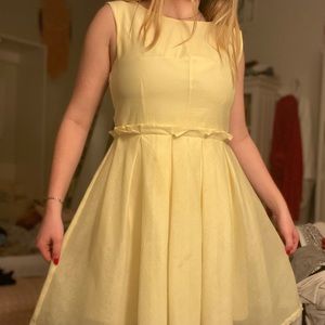 Pastel yellow fit and flare dress! Brand: Angel eye London